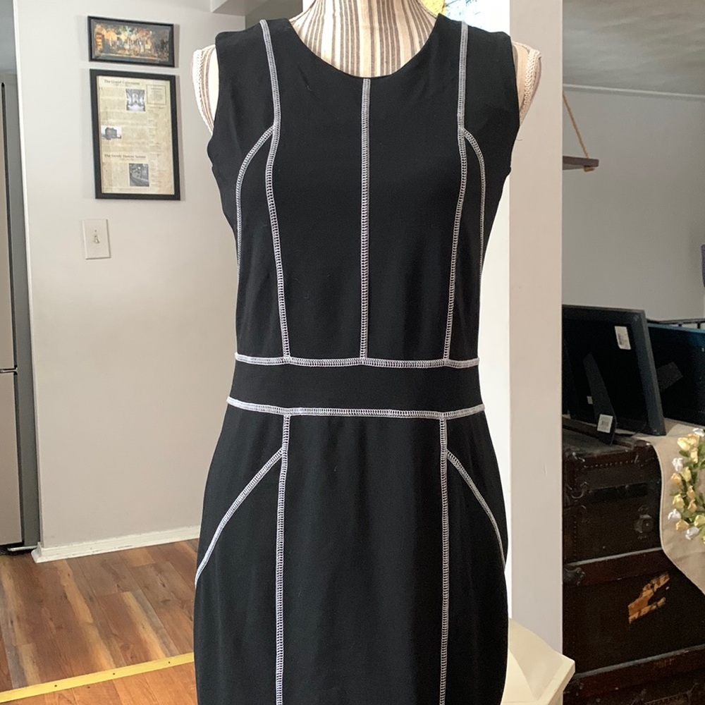 Eva & Claudi Black sleeveless stretch dress with white thread piping.